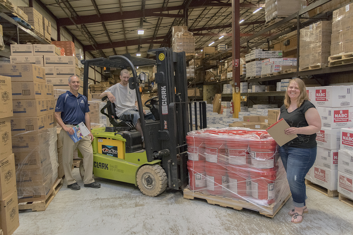 A group shot of employees in the warehouse.